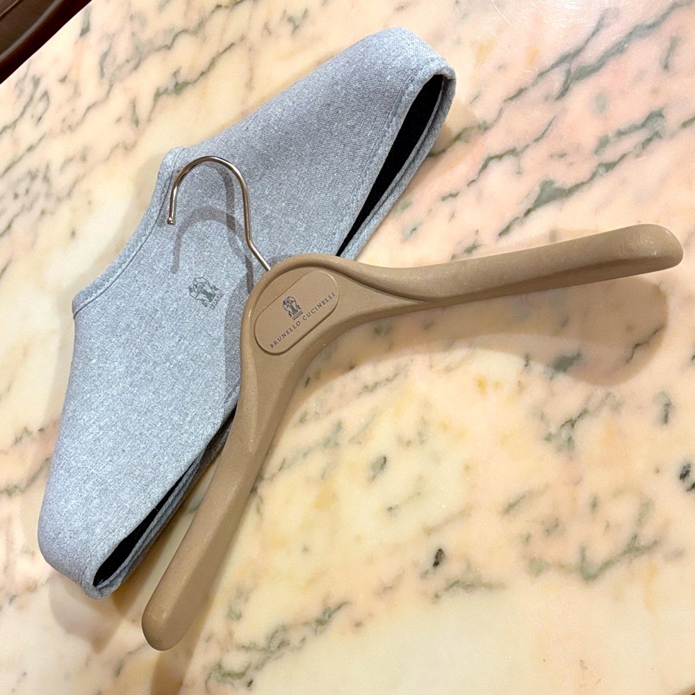 Brunello Cucinelli wood coat hanger with felt padded canvas topper